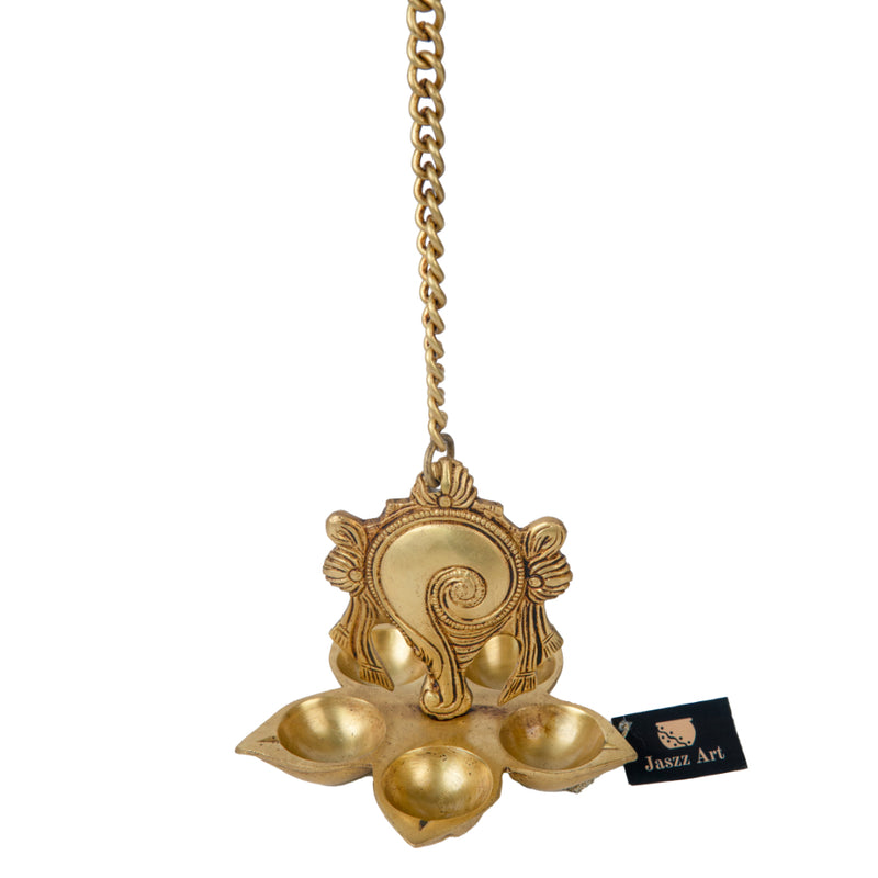 Brass Wall Diya - intricately designed brass oil lamp for wall mounting, golden finish, decorative home accent, traditional Indian Diya, emits a warm and inviting glow, ideal for enhancing wall decor and creating an ambiance of serenity, perfect for religious ceremonies and festive occasions, adds a touch of traditional charm to interior spaces.