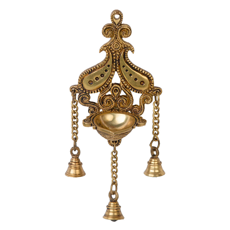 Brass Wall Diya - intricately designed brass oil lamp for wall mounting, golden finish, decorative home accent, traditional Indian Diya, emits a warm and inviting glow, ideal for enhancing wall decor and creating an ambiance of serenity, perfect for religious ceremonies and festive occasions, adds a touch of traditional charm to interior spaces.