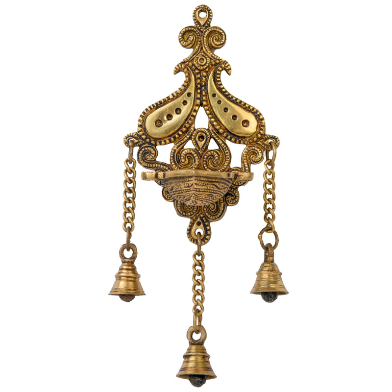 Brass Wall Diya - intricately designed brass oil lamp for wall mounting, golden finish, decorative home accent, traditional Indian Diya, emits a warm and inviting glow, ideal for enhancing wall decor and creating an ambiance of serenity, perfect for religious ceremonies and festive occasions, adds a touch of traditional charm to interior spaces.