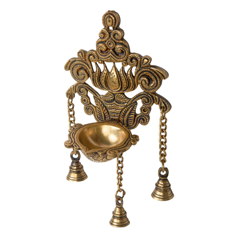 Brass Wall Diya - intricately designed brass oil lamp for wall mounting, golden finish, decorative home accent, traditional Indian Diya, emits a warm and inviting glow, ideal for enhancing wall decor and creating an ambiance of serenity, perfect for religious ceremonies and festive occasions, adds a touch of traditional charm to interior spaces.