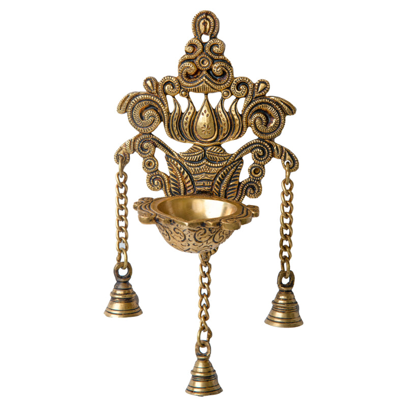 Brass Wall Diya - intricately designed brass oil lamp for wall mounting, golden finish, decorative home accent, traditional Indian Diya, emits a warm and inviting glow, ideal for enhancing wall decor and creating an ambiance of serenity, perfect for religious ceremonies and festive occasions, adds a touch of traditional charm to interior spaces.