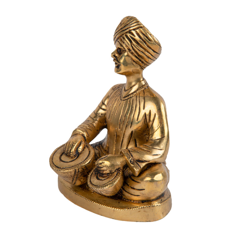 Brass Musician - intricately crafted brass statue of a musician playing a traditional instrument, golden finish, captures the beauty and rhythm of music, adds an artistic and cultural touch to your home decor, symbolizes the power of expression and creativity, perfect for music lovers and collectors, a unique and captivating addition to your collection of brass sculptures and figurines, ideal for music rooms, studios, or as a gift for musicians and enthusiasts