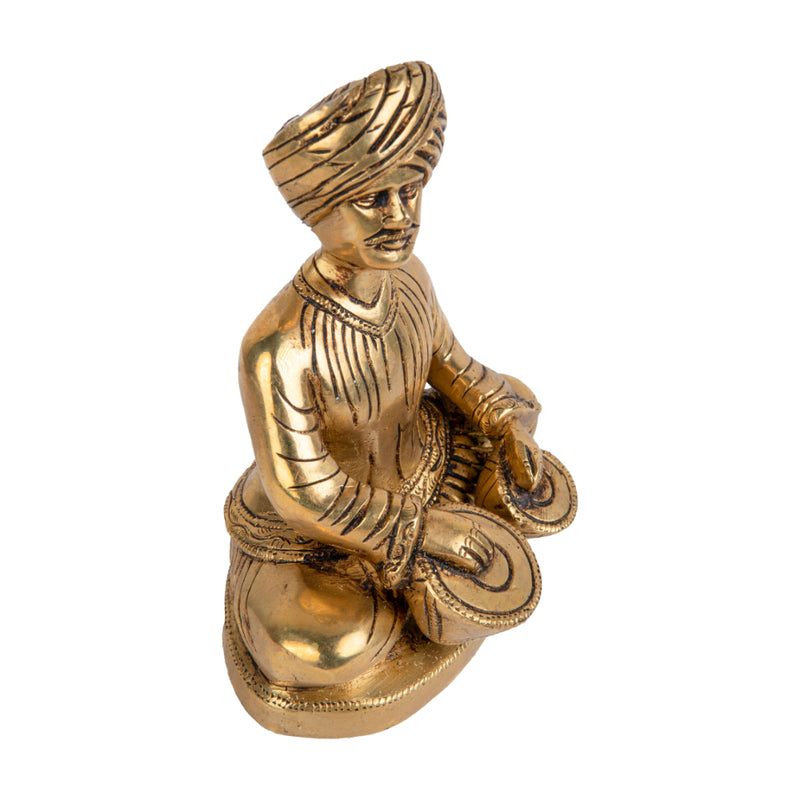 Brass Musician - intricately crafted brass statue of a musician playing a traditional instrument, golden finish, captures the beauty and rhythm of music, adds an artistic and cultural touch to your home decor, symbolizes the power of expression and creativity, perfect for music lovers and collectors, a unique and captivating addition to your collection of brass sculptures and figurines, ideal for music rooms, studios, or as a gift for musicians and enthusiasts