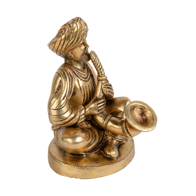 Brass Musician - intricately crafted brass statue of a musician playing a traditional instrument, golden finish, captures the beauty and rhythm of music, adds an artistic and cultural touch to your home decor, symbolizes the power of expression and creativity, perfect for music lovers and collectors, a unique and captivating addition to your collection of brass sculptures and figurines, ideal for music rooms, studios, or as a gift for musicians and enthusiasts