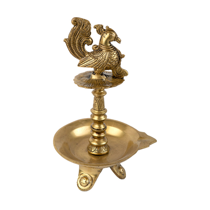 Brass peacock parrot Diya - exquisitely crafted brass oil lamp in the shape of a peacock with parrot motifs, golden finish, decorative home accent, fusion of elegance and vibrancy, traditional Indian Diya, emits a captivating and auspicious glow, perfect for festive occasions and religious ceremonies, enhances spiritual ambiance and decor with a touch of artistic brilliance.