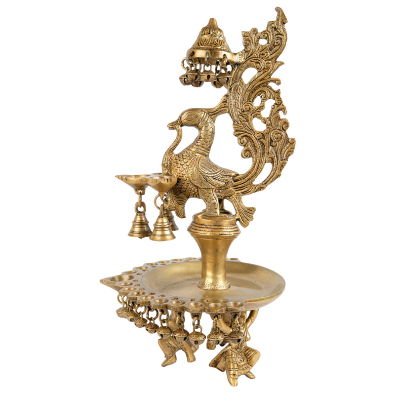 Brass peacock parrot Diya - exquisitely crafted brass oil lamp in the shape of a peacock with parrot motifs, golden finish, decorative home accent, fusion of elegance and vibrancy, traditional Indian Diya, emits a captivating and auspicious glow, perfect for festive occasions and religious ceremonies, enhances spiritual ambiance and decor with a touch of artistic brilliance.