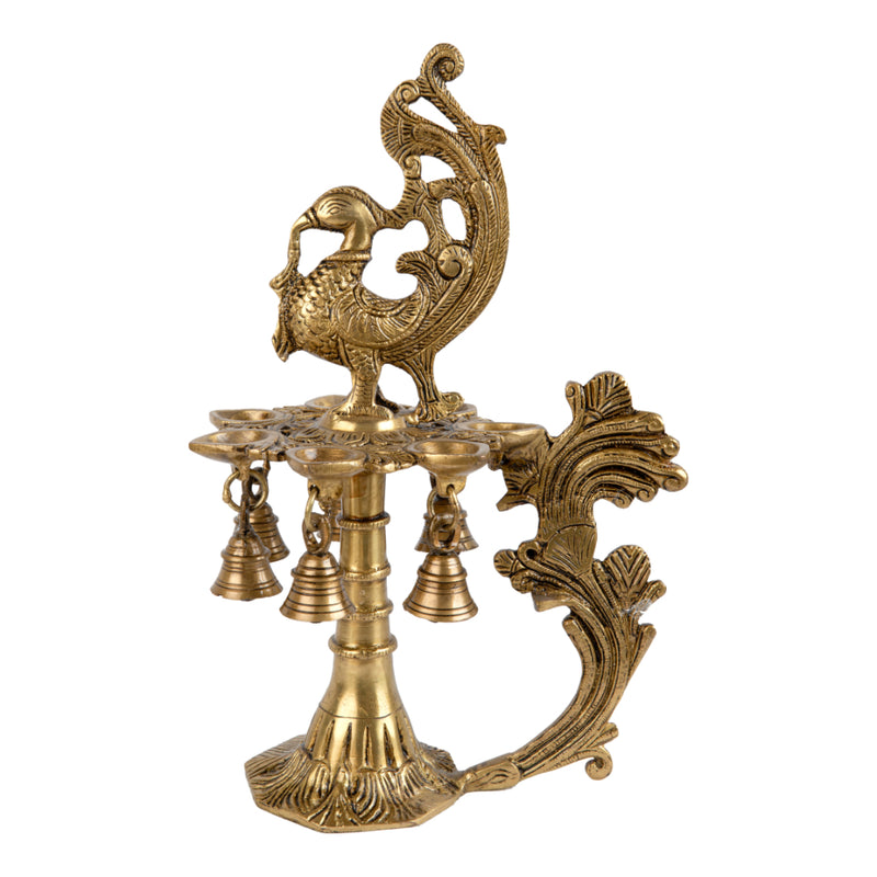 Brass peacock parrot Diya - exquisitely crafted brass oil lamp in the shape of a peacock with parrot motifs, golden finish, decorative home accent, fusion of elegance and vibrancy, traditional Indian Diya, emits a captivating and auspicious glow, perfect for festive occasions and religious ceremonies, enhances spiritual ambiance and decor with a touch of artistic brilliance.