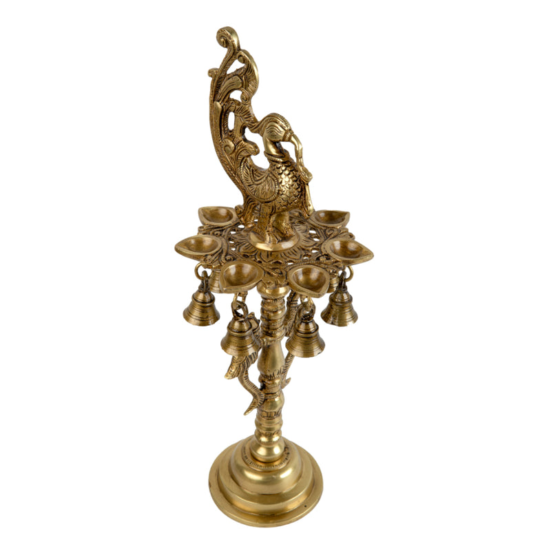 Brass peacock parrot Diya - exquisitely crafted brass oil lamp in the shape of a peacock with parrot motifs, golden finish, decorative home accent, fusion of elegance and vibrancy, traditional Indian Diya, emits a captivating and auspicious glow, perfect for festive occasions and religious ceremonies, enhances spiritual ambiance and decor with a touch of artistic brilliance.