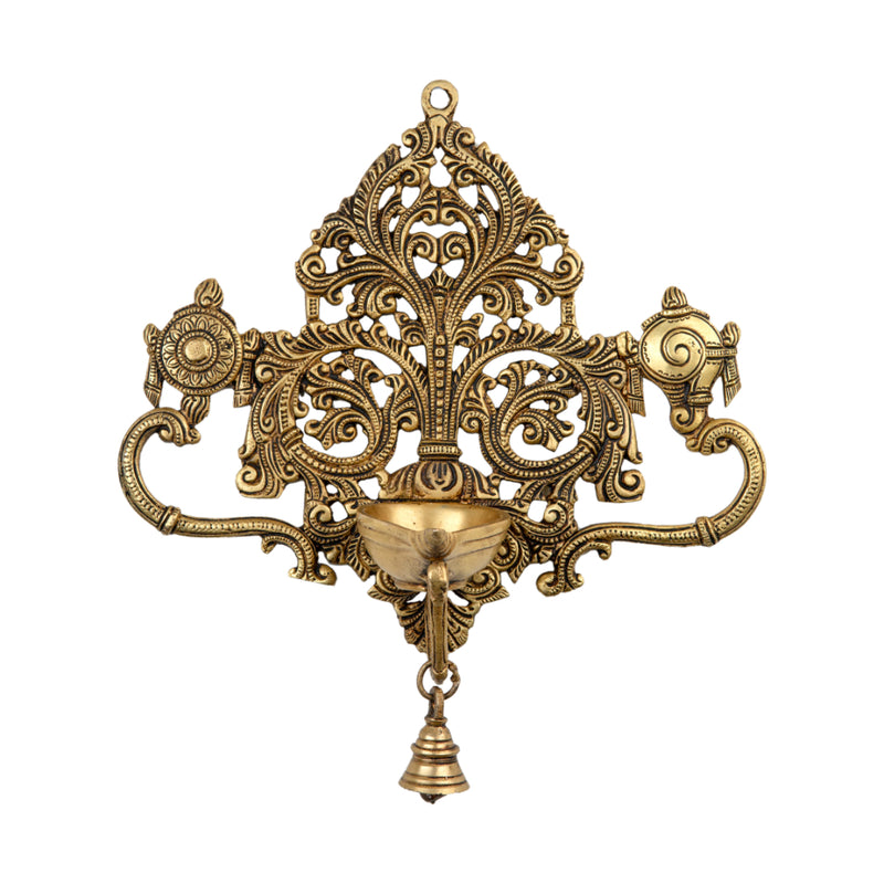 Brass Wall Diya - intricately designed brass oil lamp for wall mounting, golden finish, decorative home accent, traditional Indian Diya, emits a warm and inviting glow, ideal for enhancing wall decor and creating an ambiance of serenity, perfect for religious ceremonies and festive occasions, adds a touch of traditional charm to interior spaces.