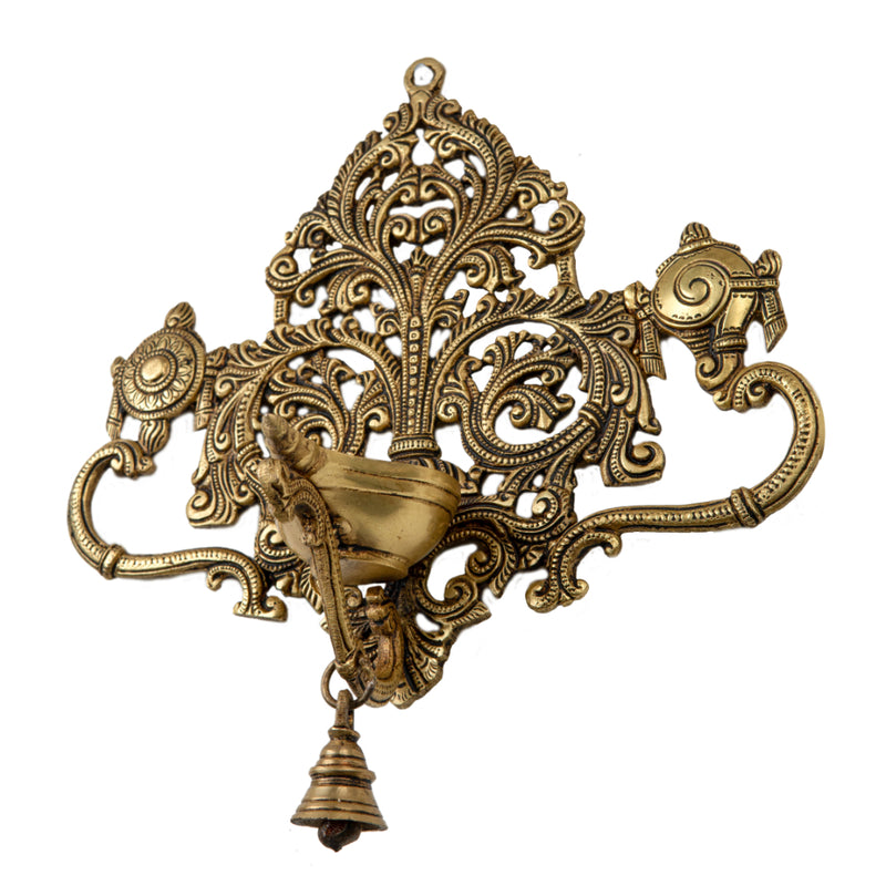 Brass Wall Diya - intricately designed brass oil lamp for wall mounting, golden finish, decorative home accent, traditional Indian Diya, emits a warm and inviting glow, ideal for enhancing wall decor and creating an ambiance of serenity, perfect for religious ceremonies and festive occasions, adds a touch of traditional charm to interior spaces.