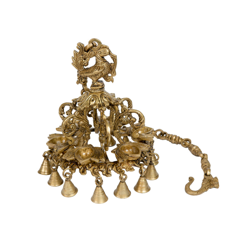 Brass peacock parrot Diya - exquisitely crafted brass oil lamp in the shape of a peacock with parrot motifs, golden finish, decorative home accent, fusion of elegance and vibrancy, traditional Indian Diya, emits a captivating and auspicious glow, perfect for festive occasions and religious ceremonies, enhances spiritual ambiance and decor with a touch of artistic brilliance.