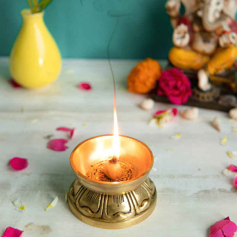 Brass small Akhand Diya - intricately designed brass oil lamp, compact size, traditional Indian Diya, golden finish, decorative home accent, emits a warm and serene glow, ideal for religious ceremonies and meditation, enhances spiritual ambiance and decor.