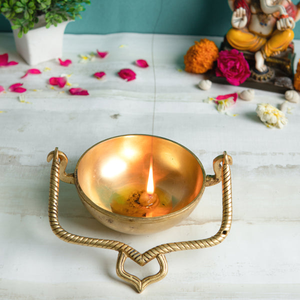 Brass Urli - beautifully crafted brass decorative bowl, golden finish, traditional Indian Urli, versatile home accent, ideal for floating flower petals or candles, adds a touch of elegance and tranquility to any space, perfect for creating a serene ambiance and enhancing interior decor, a timeless piece of art for both indoor and outdoor settings.