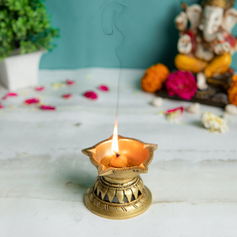 Brass small Akhand Diya - intricately designed brass oil lamp, compact size, traditional Indian Diya, golden finish, decorative home accent, emits a warm and serene glow, ideal for religious ceremonies and meditation, enhances spiritual ambiance and decor.