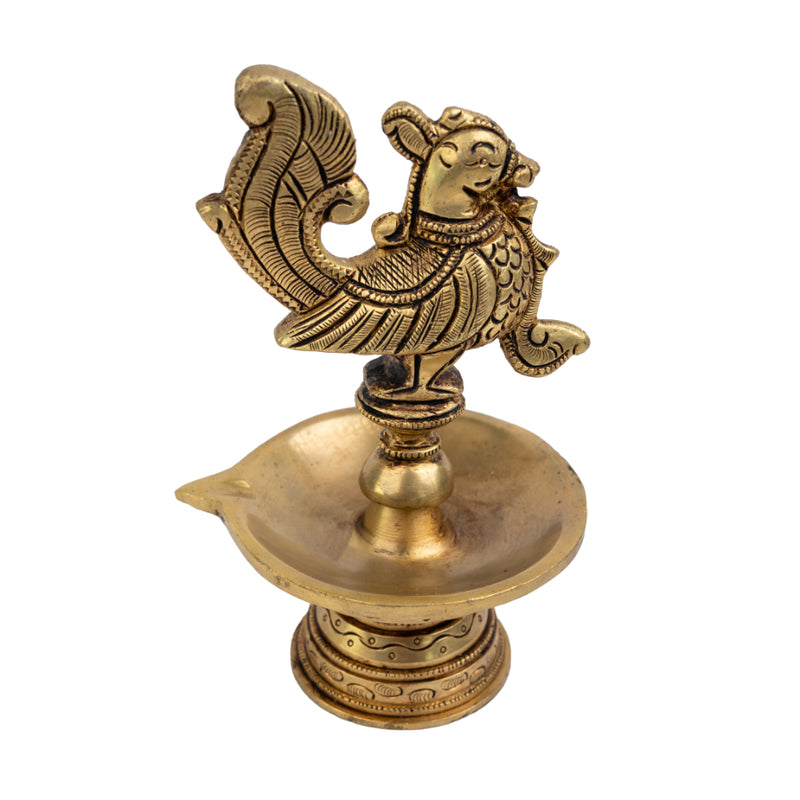 Brass peacock parrot Diya - exquisitely crafted brass oil lamp in the shape of a peacock with parrot motifs, golden finish, decorative home accent, fusion of elegance and vibrancy, traditional Indian Diya, emits a captivating and auspicious glow, perfect for festive occasions and religious ceremonies, enhances spiritual ambiance and decor with a touch of artistic brilliance.