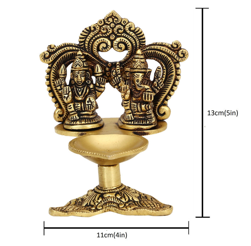 Brass Ganesha Lakshmi Diya - exquisitely crafted brass oil lamp featuring Lord Ganesha and Goddess Lakshmi, golden finish, decorative home accent, symbolizes prosperity and divine blessings, traditional Indian Diya, emits a radiant and auspicious glow, perfect for religious ceremonies and festive occasions, enhances spiritual ambiance and decor with the blessings of Ganesha and Lakshmi.