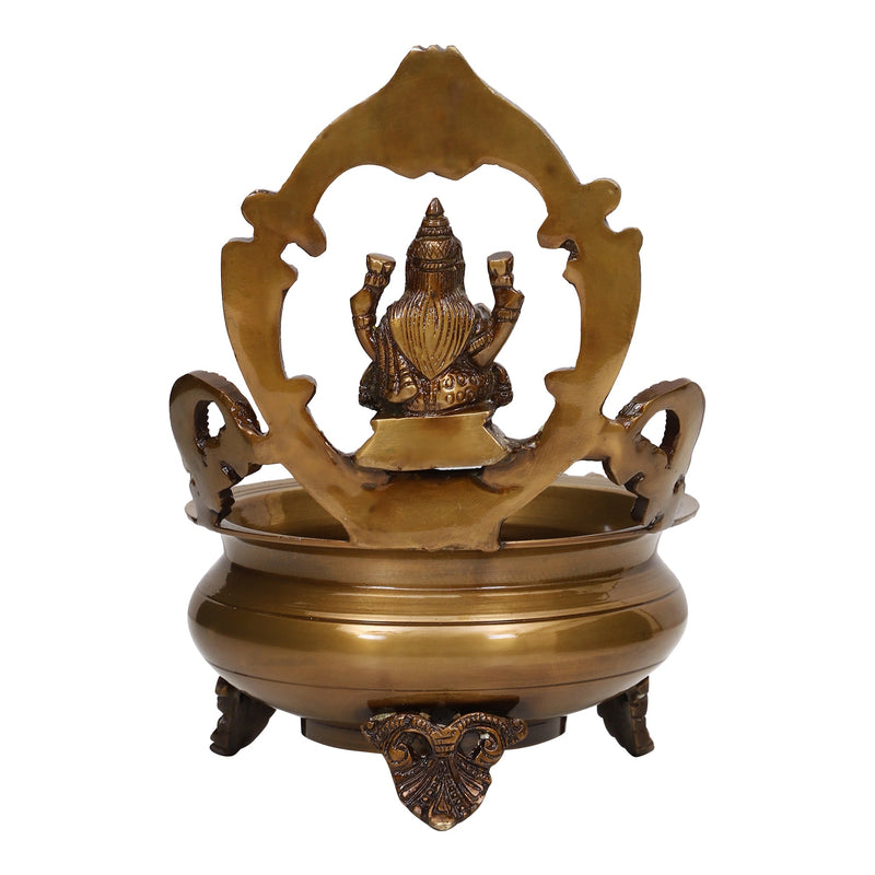 Brass Lakshmi & Ganesh Ji Urli - intricately crafted brass decorative bowl featuring idols of Goddess Lakshmi and Lord Ganesh, golden finish, traditional Indian Urli, versatile home accent, ideal for floating flower petals or candles, symbolizes prosperity and blessings, adds a touch of divinity and cultural richness to any space, perfect for creating an auspicious ambiance and enhancing interior decor, a timeless piece of art for both indoor and outdoor settings.