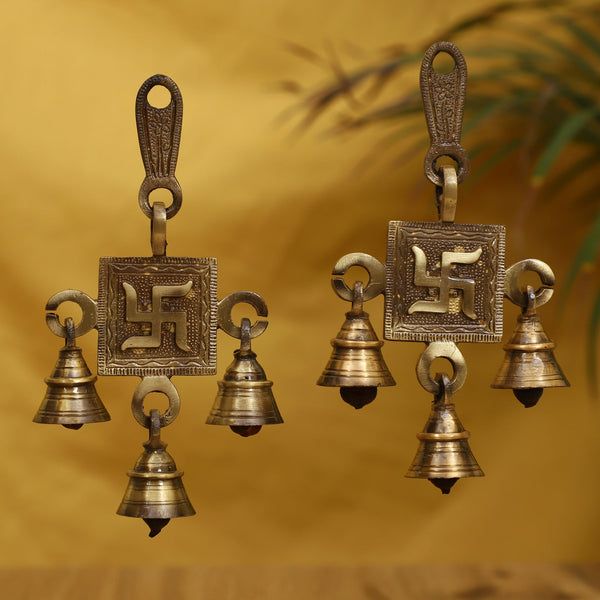 Brass Swastik Bells - beautifully crafted brass bells with Swastik symbol, golden finish, decorative home accent, emits a melodious and auspicious sound, perfect for invoking positive energy and blessings, ideal for spiritual practices, ceremonies, and home decor, symbolizes good luck, prosperity, and spiritual well-being, enhances the ambiance with positive vibrations, a sacred and meaningful addition to your collection of brass artifacts.