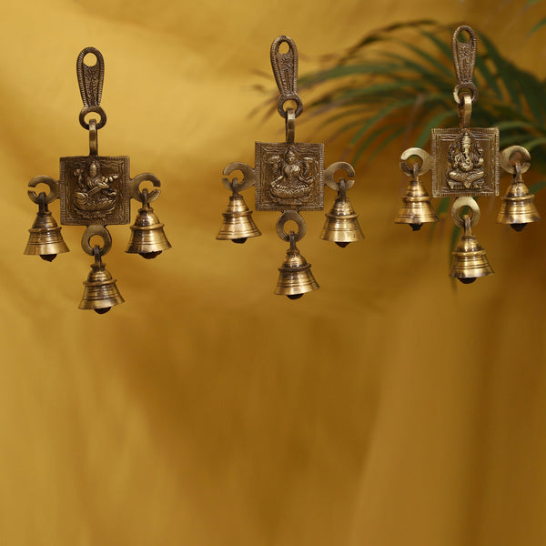 Brass Lakshmi Ganesh Saraswati Bells - exquisitely crafted brass bells featuring the deities Lakshmi, Ganesh, and Saraswati, golden finish, decorative home accent, emits a harmonious and divine sound, perfect for invoking blessings and wisdom, ideal for spiritual practices, rituals, and festive occasions, symbolizes prosperity, success, and knowledge, enhances the ambiance with positive vibrations and divine energy, a sacred and auspicious addition to your collection of brass artifacts.