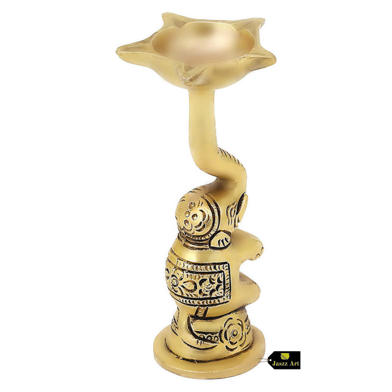 Brass Elephant Diya - intricately designed brass oil lamp in the shape of an elephant, golden finish, decorative home accent, symbolizes strength and wisdom, traditional Indian Diya, emits a warm and enchanting glow, ideal for religious ceremonies and festive occasions, enhances spiritual ambiance and decor