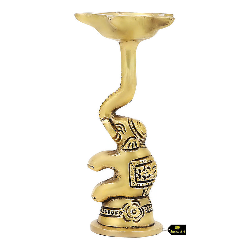  Brass Elephant Diya - intricately designed brass oil lamp in the shape of an elephant, golden finish, decorative home accent, symbolizes strength and wisdom, traditional Indian Diya, emits a warm and enchanting glow, ideal for religious ceremonies and festive occasions, enhances spiritual ambiance and decor