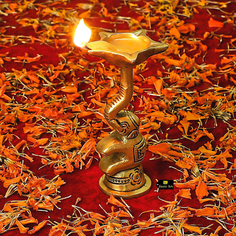  Brass Elephant Diya - intricately designed brass oil lamp in the shape of an elephant, golden finish, decorative home accent, symbolizes strength and wisdom, traditional Indian Diya, emits a warm and enchanting glow, ideal for religious ceremonies and festive occasions, enhances spiritual ambiance and decor