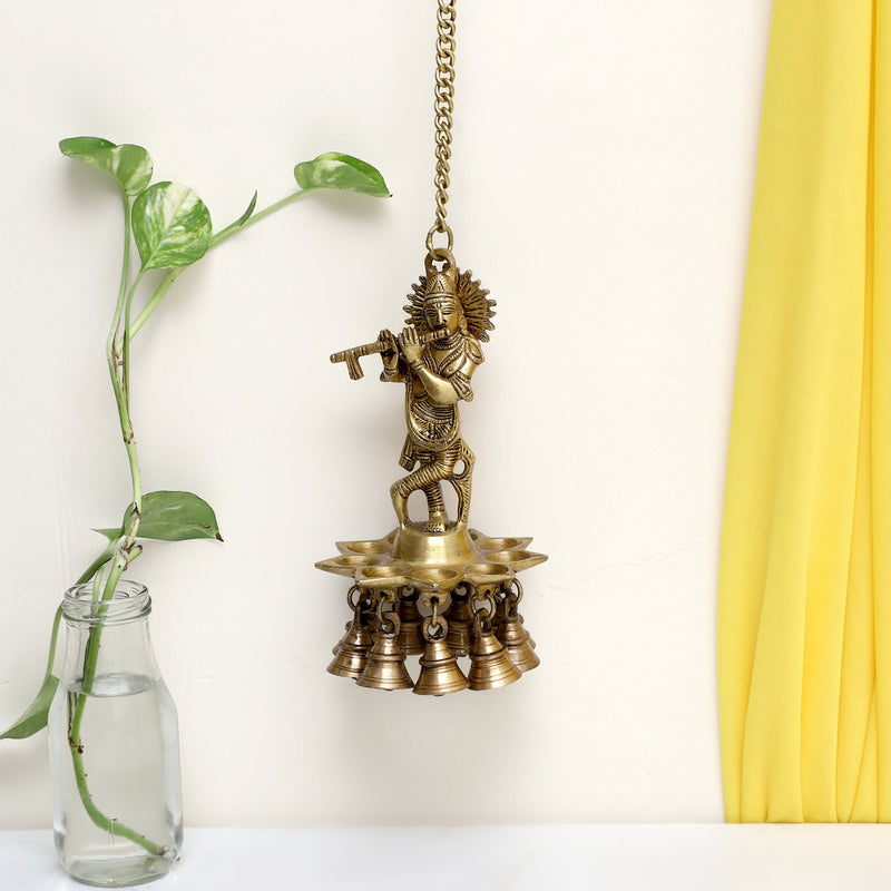 Brass Wall Diya - intricately designed brass oil lamp for wall mounting, golden finish, decorative home accent, traditional Indian Diya, emits a warm and inviting glow, ideal for enhancing wall decor and creating an ambiance of serenity, perfect for religious ceremonies and festive occasions, adds a touch of traditional charm to interior spaces.