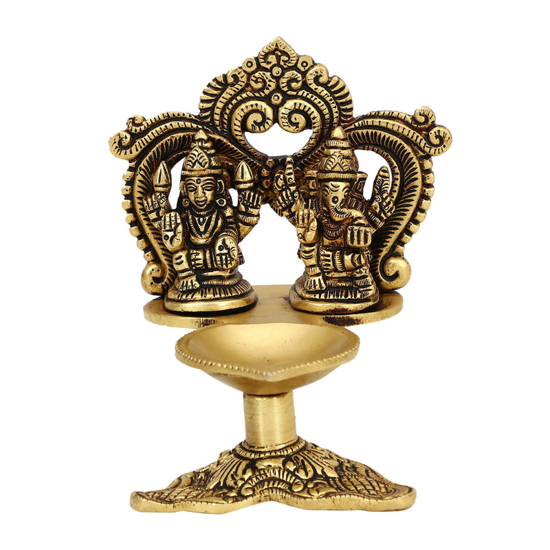 Brass Ganesha Lakshmi Diya - exquisitely crafted brass oil lamp featuring Lord Ganesha and Goddess Lakshmi, golden finish, decorative home accent, symbolizes prosperity and divine blessings, traditional Indian Diya, emits a radiant and auspicious glow, perfect for religious ceremonies and festive occasions, enhances spiritual ambiance and decor with the blessings of Ganesha and Lakshmi.