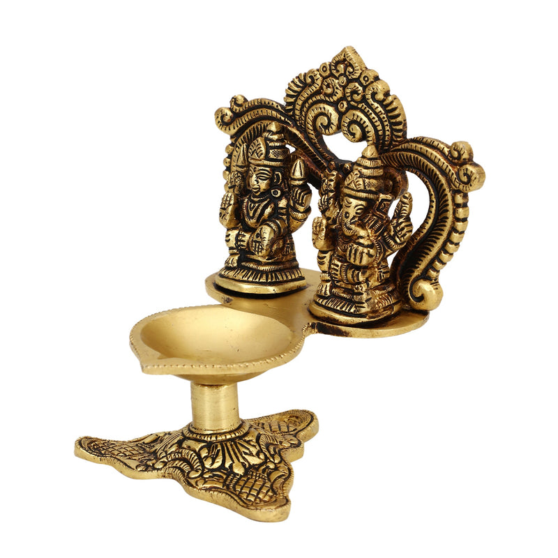 Brass Ganesha Lakshmi Diya - exquisitely crafted brass oil lamp featuring Lord Ganesha and Goddess Lakshmi, golden finish, decorative home accent, symbolizes prosperity and divine blessings, traditional Indian Diya, emits a radiant and auspicious glow, perfect for religious ceremonies and festive occasions, enhances spiritual ambiance and decor with the blessings of Ganesha and Lakshmi.