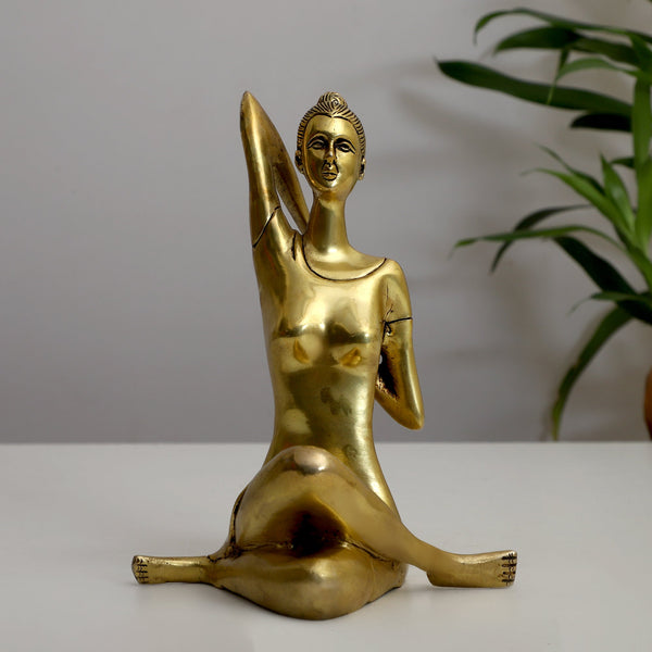 Brass Yoga Lady - beautifully sculpted brass statue of a female yogi in a yoga pose, golden finish, represents strength, balance, and mindfulness, perfect for yoga enthusiasts and spiritual practitioners, adds a serene and calming element to your home decor, symbolizes the harmony between mind, body, and spirit, a unique and inspiring addition to your collection of brass sculptures and figurines, ideal for yoga studios and meditation spaces.