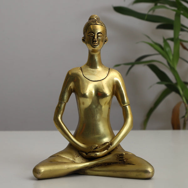 Brass Yoga Lady - beautifully sculpted brass statue of a female yogi in a yoga pose, golden finish, represents strength, balance, and mindfulness, perfect for yoga enthusiasts and spiritual practitioners, adds a serene and calming element to your home decor, symbolizes the harmony between mind, body, and spirit, a unique and inspiring addition to your collection of brass sculptures and figurines, ideal for yoga studios and meditation spaces.