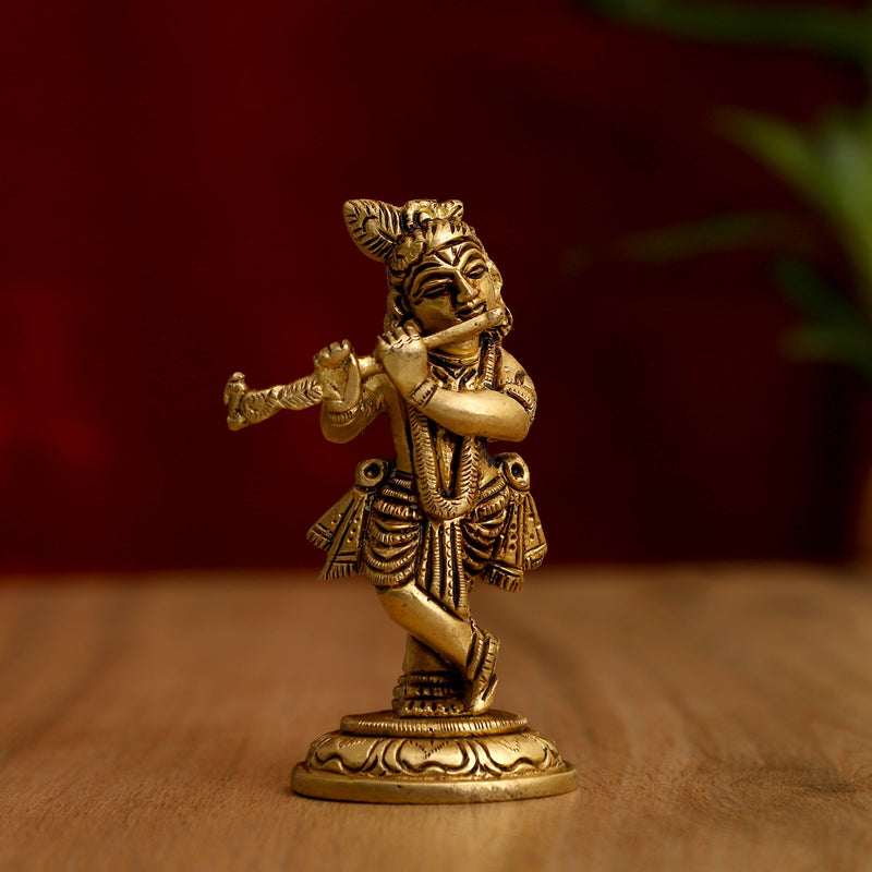 Brass God Krishna Ji - exquisitely crafted brass statue of Lord Krishna, golden finish, beloved and divine deity, perfect for home decor and spiritual spaces, ideal for invoking love and devotion, symbolizes divine playfulness, compassion, and enlightenment, enhances the spiritual energy and fosters a sense of divine presence, a sacred and enchanting addition to your collection of brass sculptures and figurines.