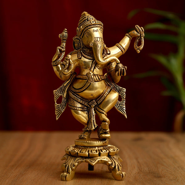 Brass God Ganesha Ji - intricately designed brass statue of Lord Ganesha, golden finish, auspicious and beloved deity, perfect for home decor and spiritual spaces, ideal for invoking blessings and removing obstacles, symbolizes wisdom, prosperity, and good fortune, enhances the spiritual energy and fosters a sense of divine presence, a sacred and revered addition to your collection of brass sculptures and figurines.