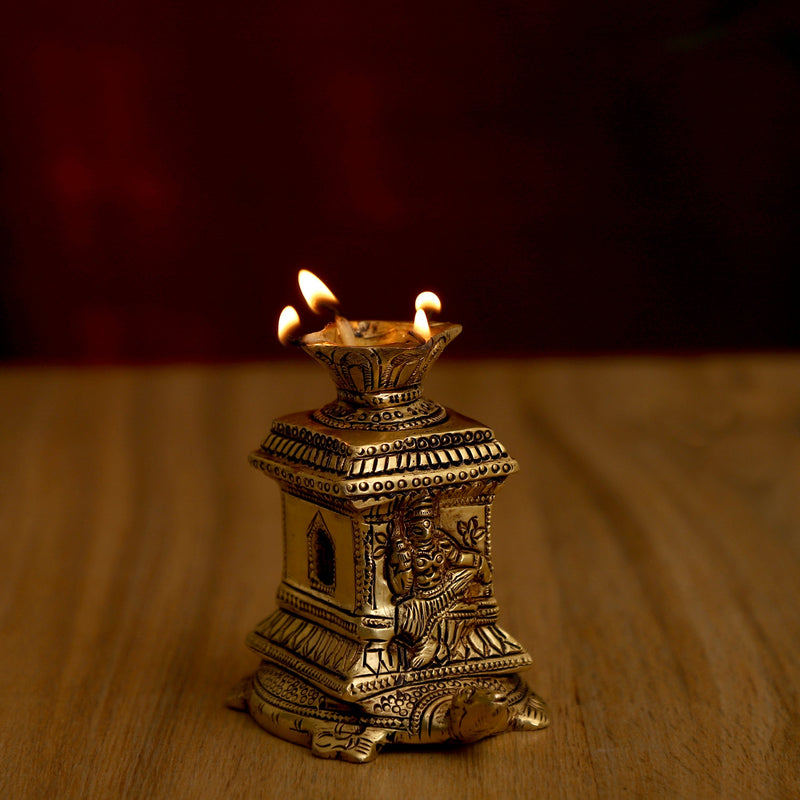 Brass small Akhand Turtle Diya - intricately designed brass oil lamp, compact size, traditional Indian Diya, golden finish, decorative home accent, emits a warm and serene glow, ideal for religious ceremonies and meditation, enhances spiritual ambiance and decor.