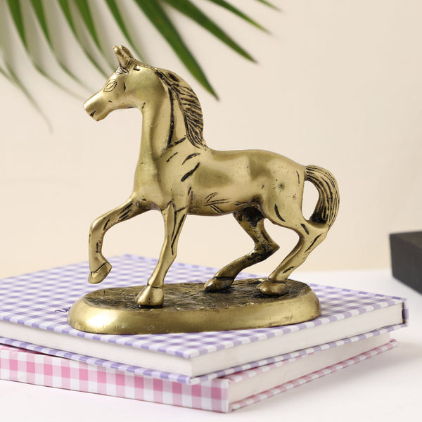 Brass horse product - intricately crafted brass sculpture, majestic horse design, detailed features, golden finish, decorative home accent, symbolizes strength and freedom, adds a touch of sophistication to any space, ideal gift for equestrian enthusiasts.