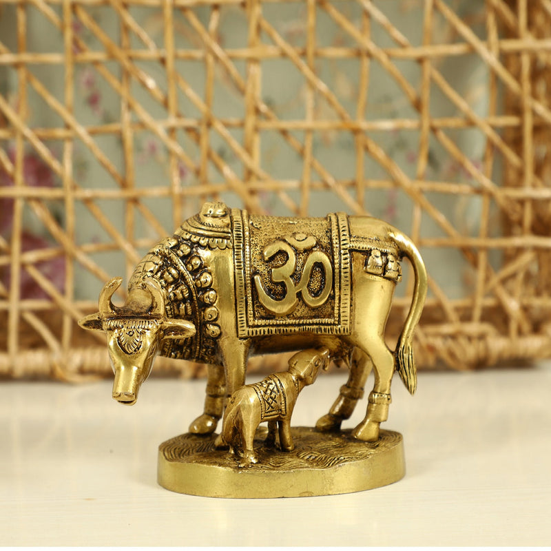 Brass God Kamdhenu Cow - finely crafted brass statue of Kamdhenu, the divine wish-fulfilling cow, golden finish, auspicious and revered deity, perfect for home decor and spiritual spaces, ideal for invoking blessings and abundance, symbolizes prosperity, fertility, and divine blessings, enhances the spiritual energy and fosters a sense of divine presence, a sacred and cherished addition to your collection of brass sculptures and figurines.